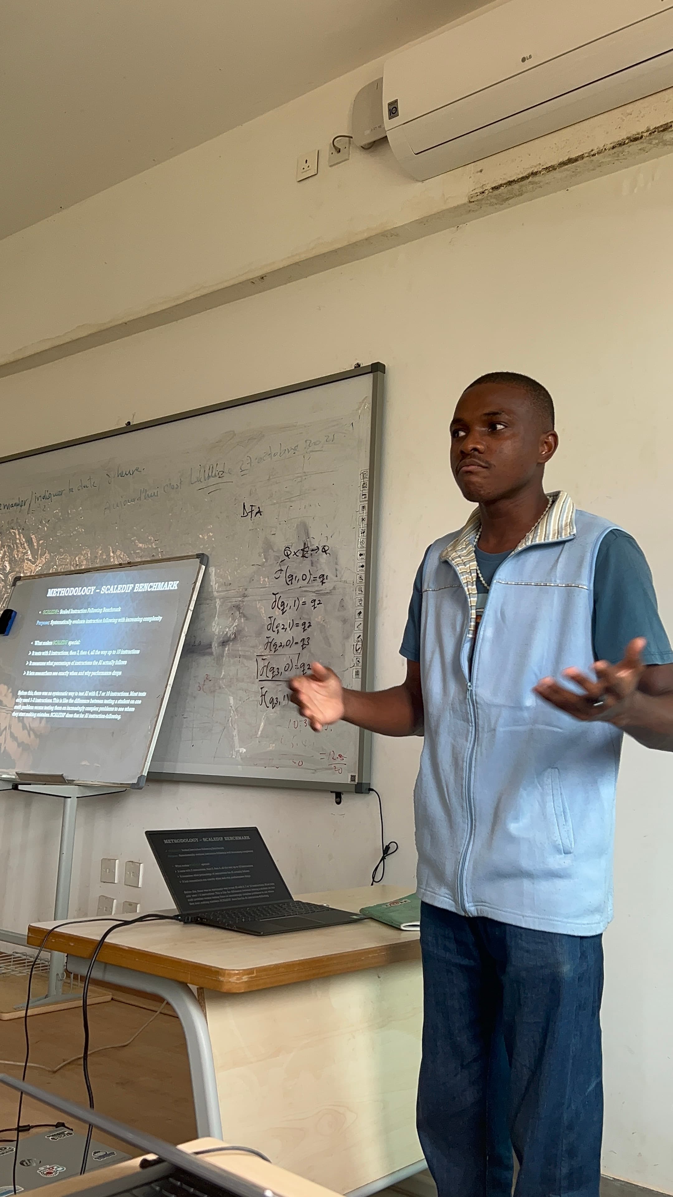 Jordan presenting in front of a classroom board