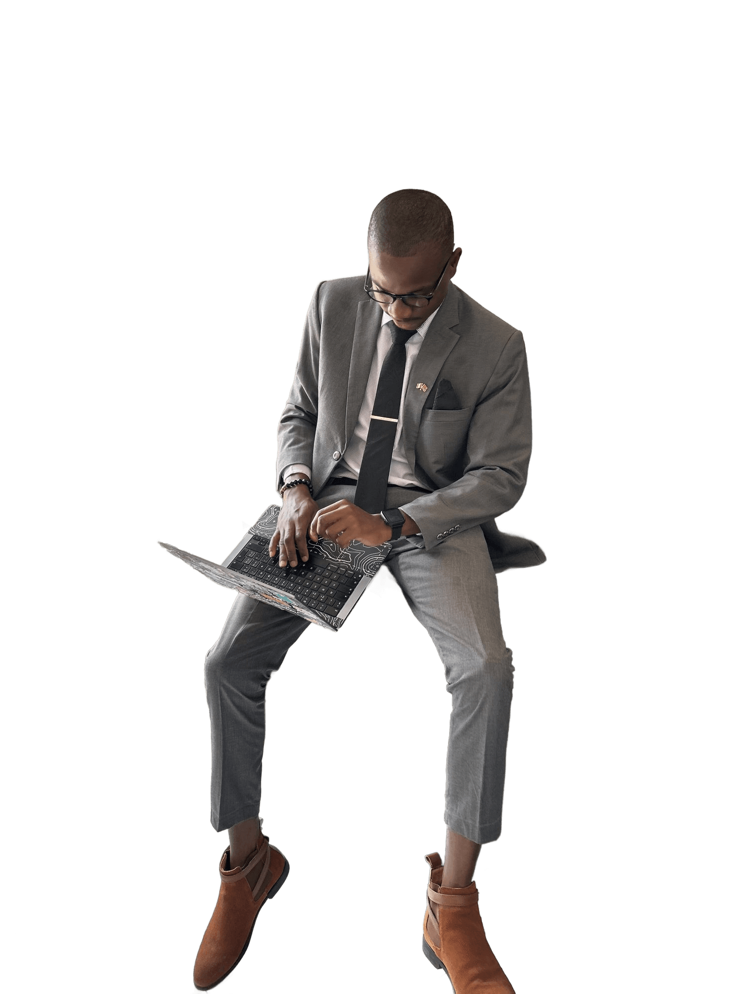 Jordan Nwabuike working on a laptop at the office